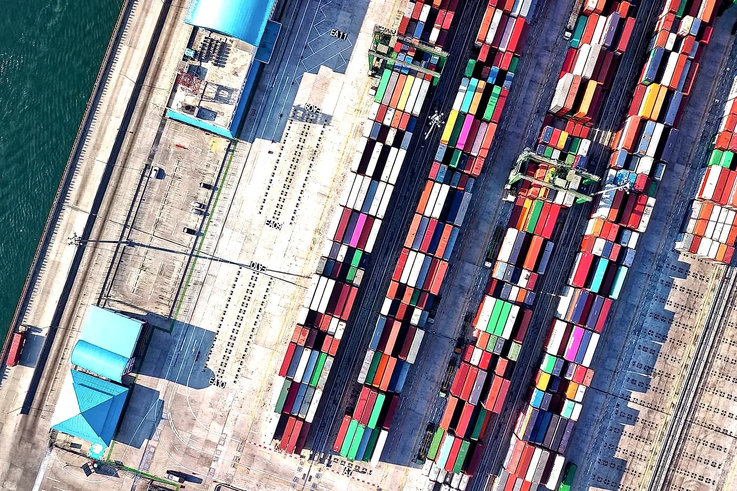 Aerial view of colourful container rows at an international trade terminal