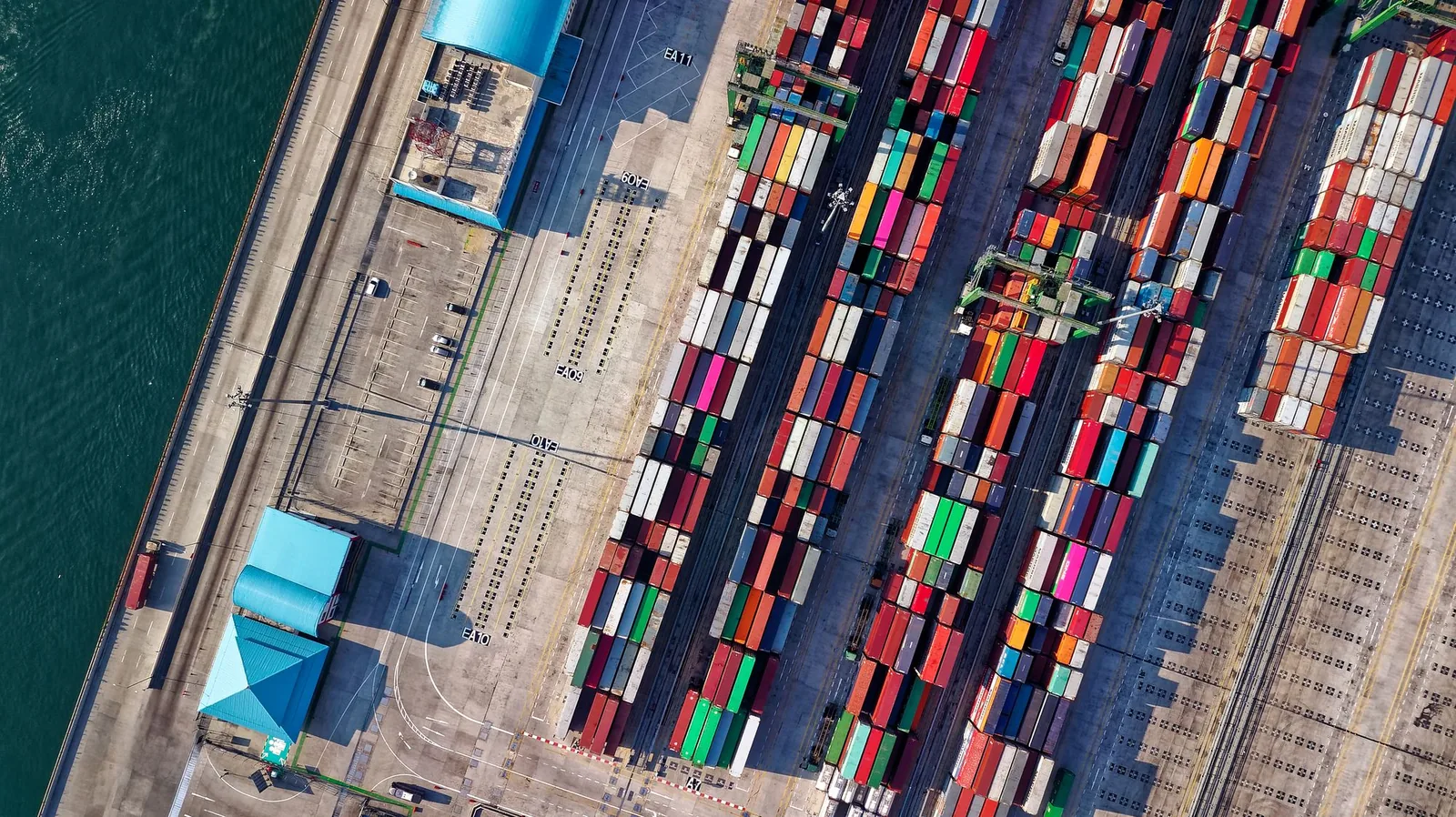 Aerial view of colourful container rows at an international trade terminal